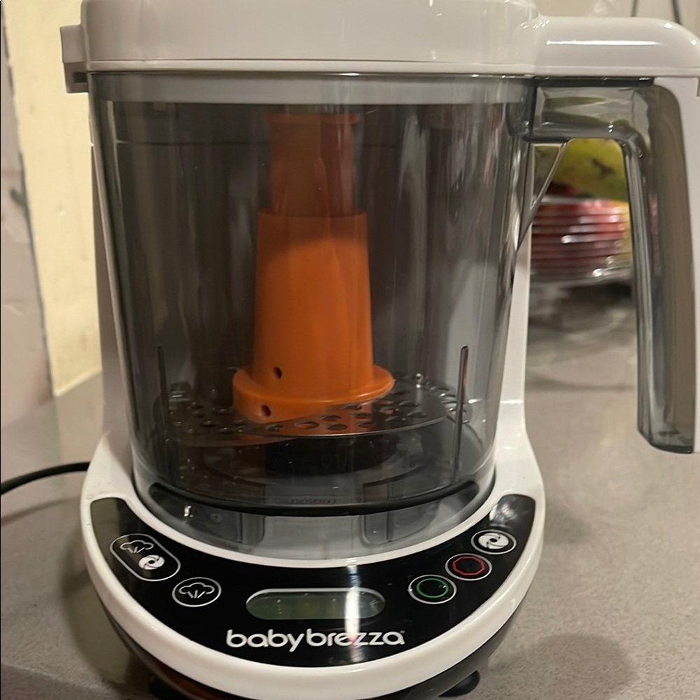 Baby Brezza Food Maker - White and Orange
Was like three times.